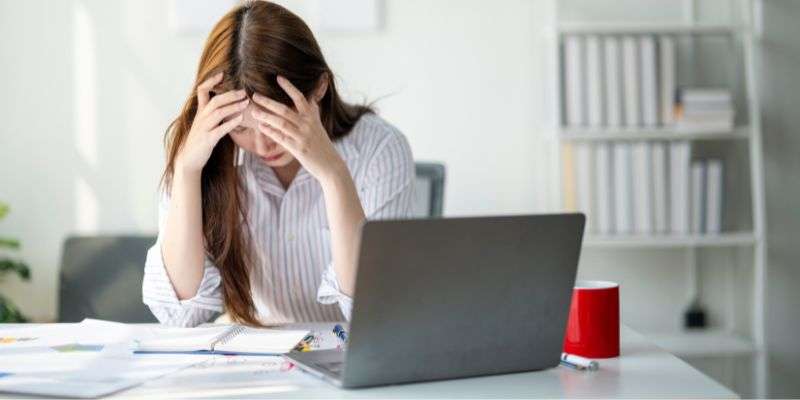 Woman stressed about her finances.