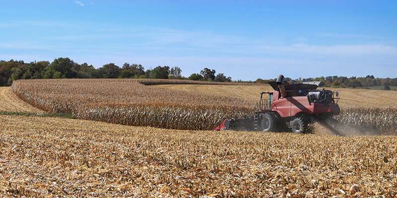 A tractor driving in a field.