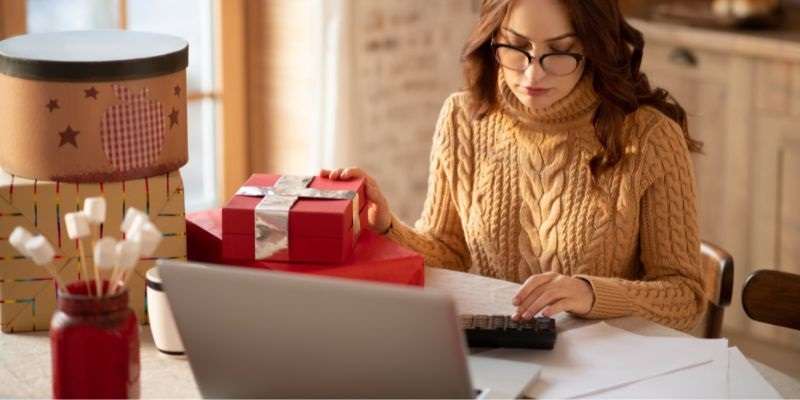 A woman analyzing her holiday budget.