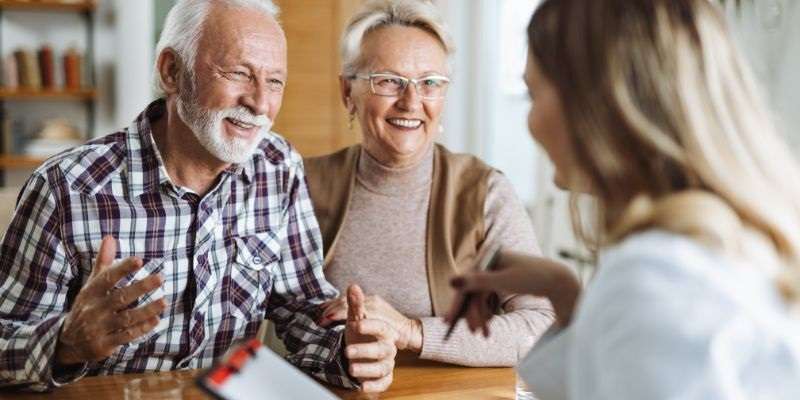 Older couple talking with their healthcare provider.