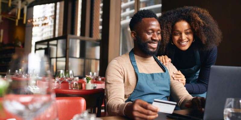 Business couple analyzing their business credit.