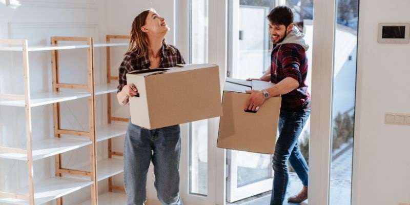 Couple moving into their new home.