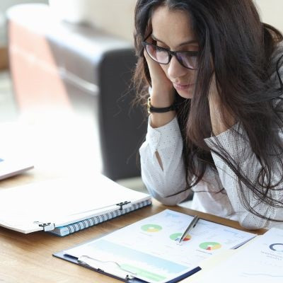 Woman observing her difference finances.