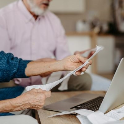 Couple viewing their bank statements.