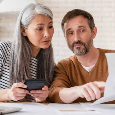 Couple discussing different health savings accounts.