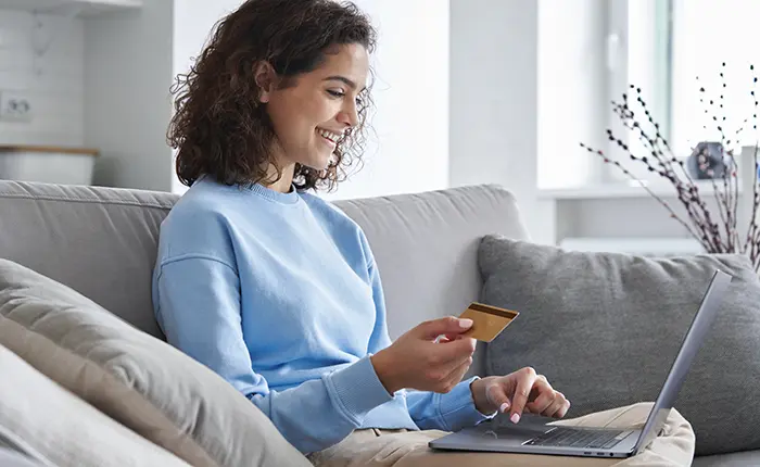 woman on laptop with credit card